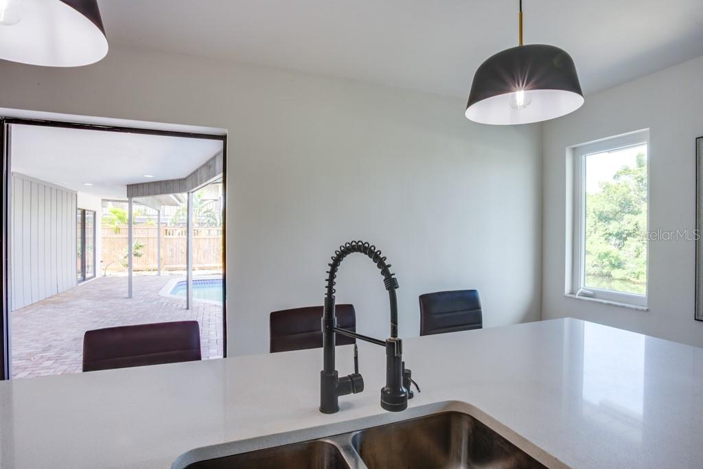 Kitchen offers quartz countertops.