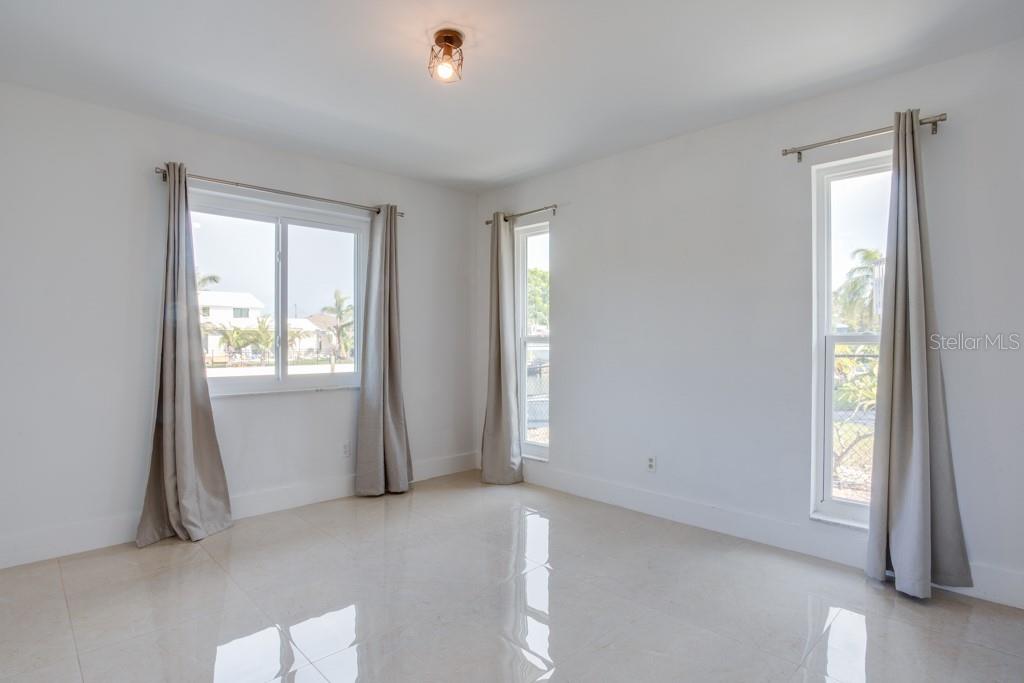 Guest bedroom features water views.