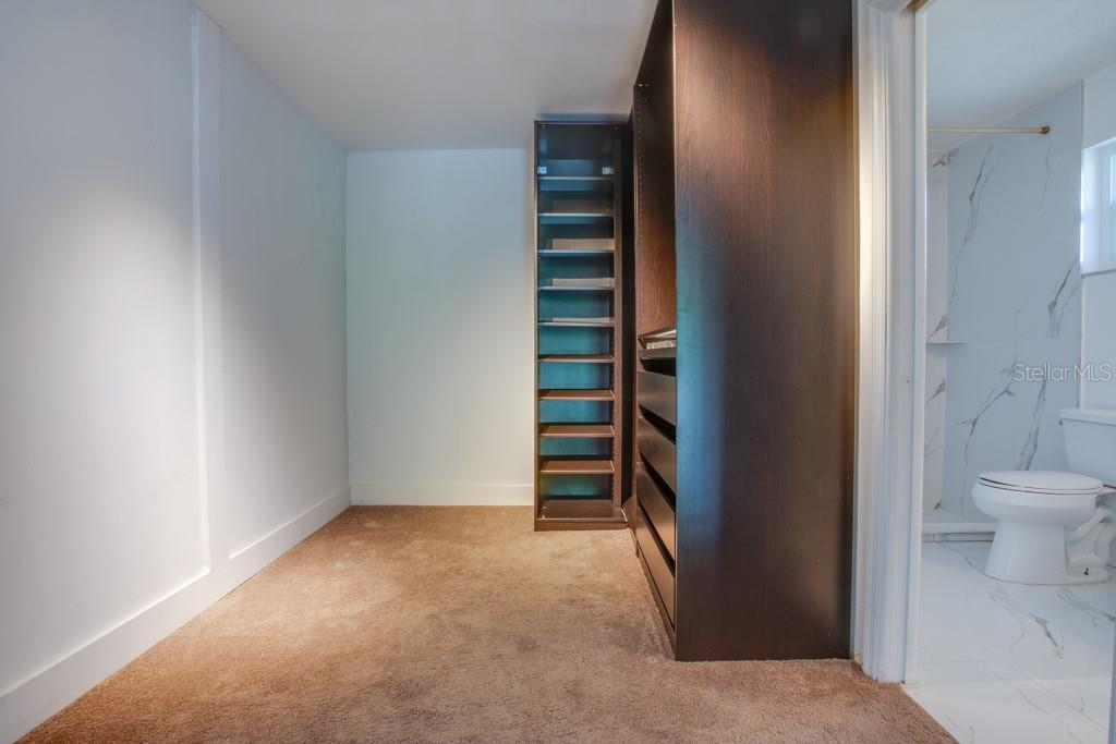 Primary walk-in closet.