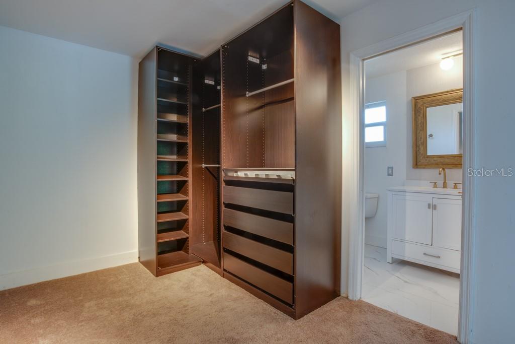 Primary walk-in closet.