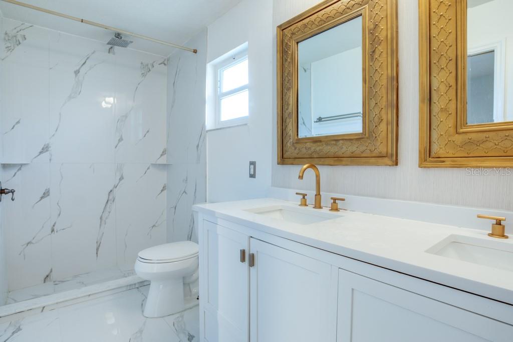 Primary walk-in shower.