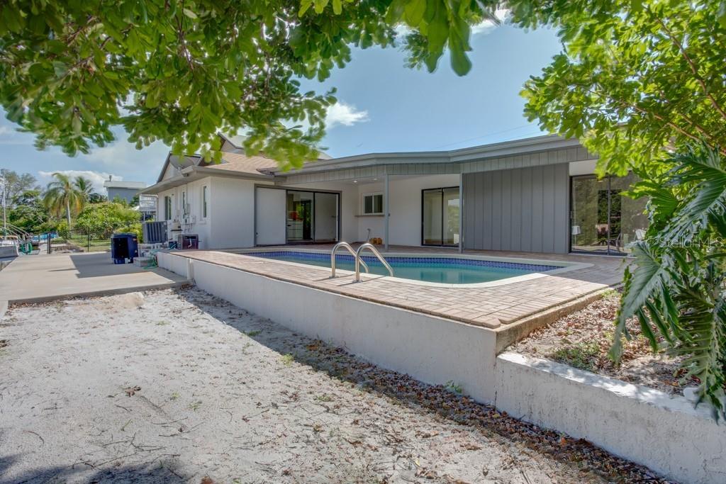 Sandy beach area is perfect for games or a fire pit.