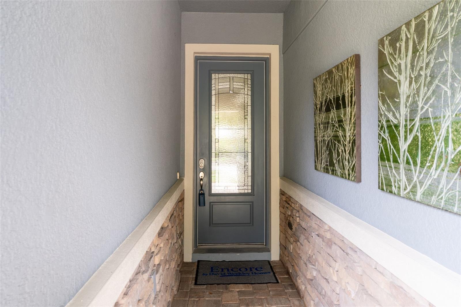 Covered Front Entrance with Pretty Leaded Glass Door