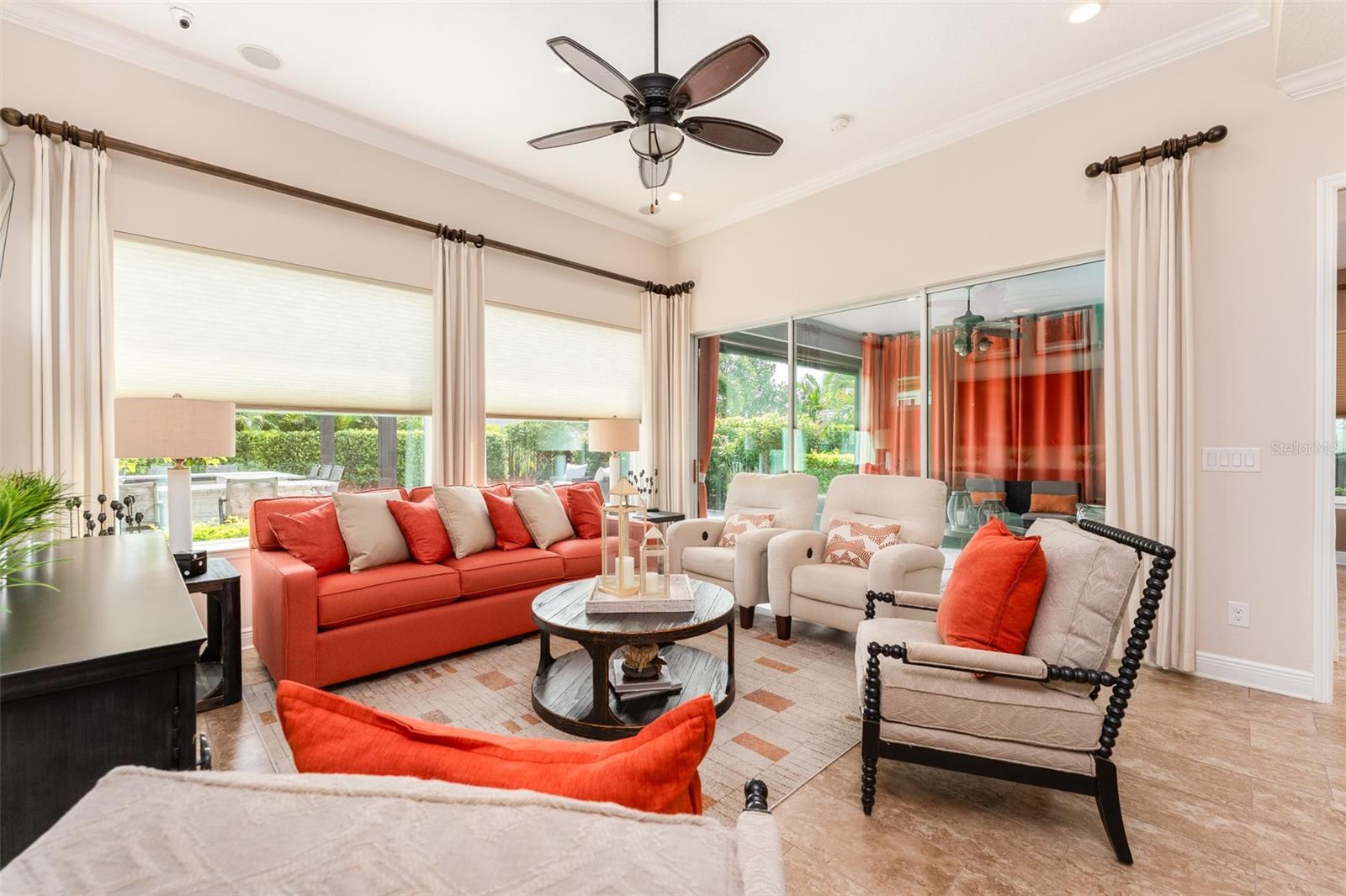 Living Space with Large Windows Overlooking the Spectular Outdoor Space & Sliders for Access to Covered Screened Back Porch & Outdoor Living Space