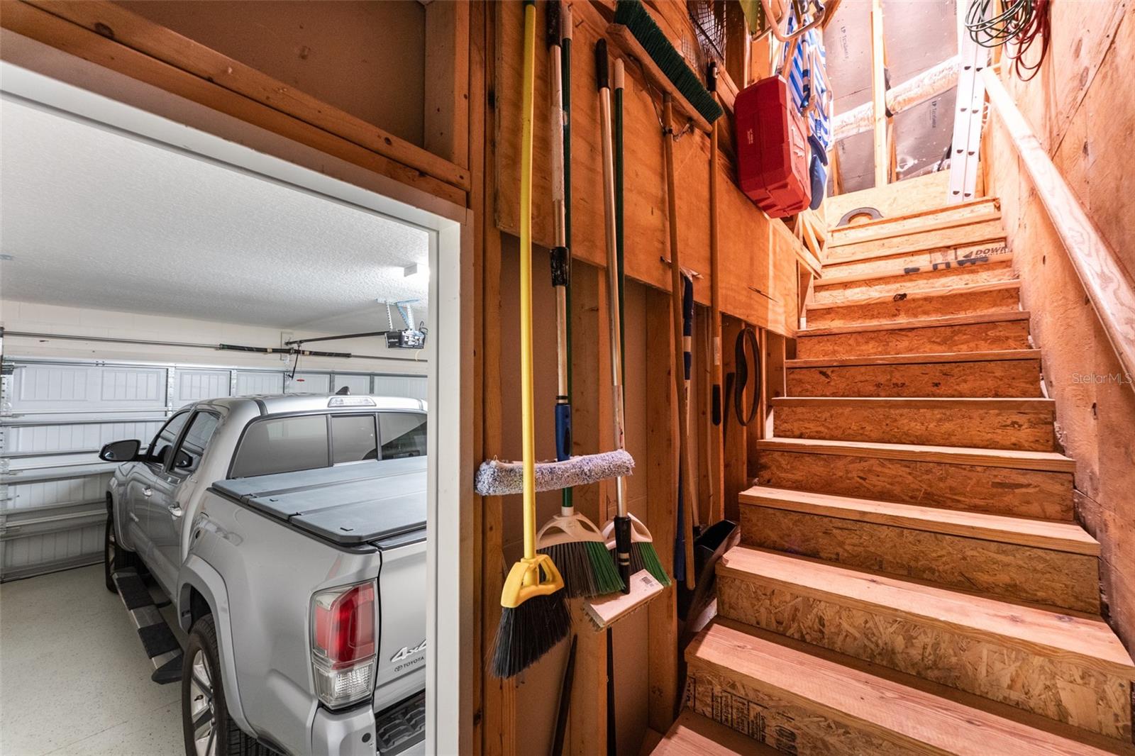 Steps in Garage Leading up to Floored Abundant Attic Storage