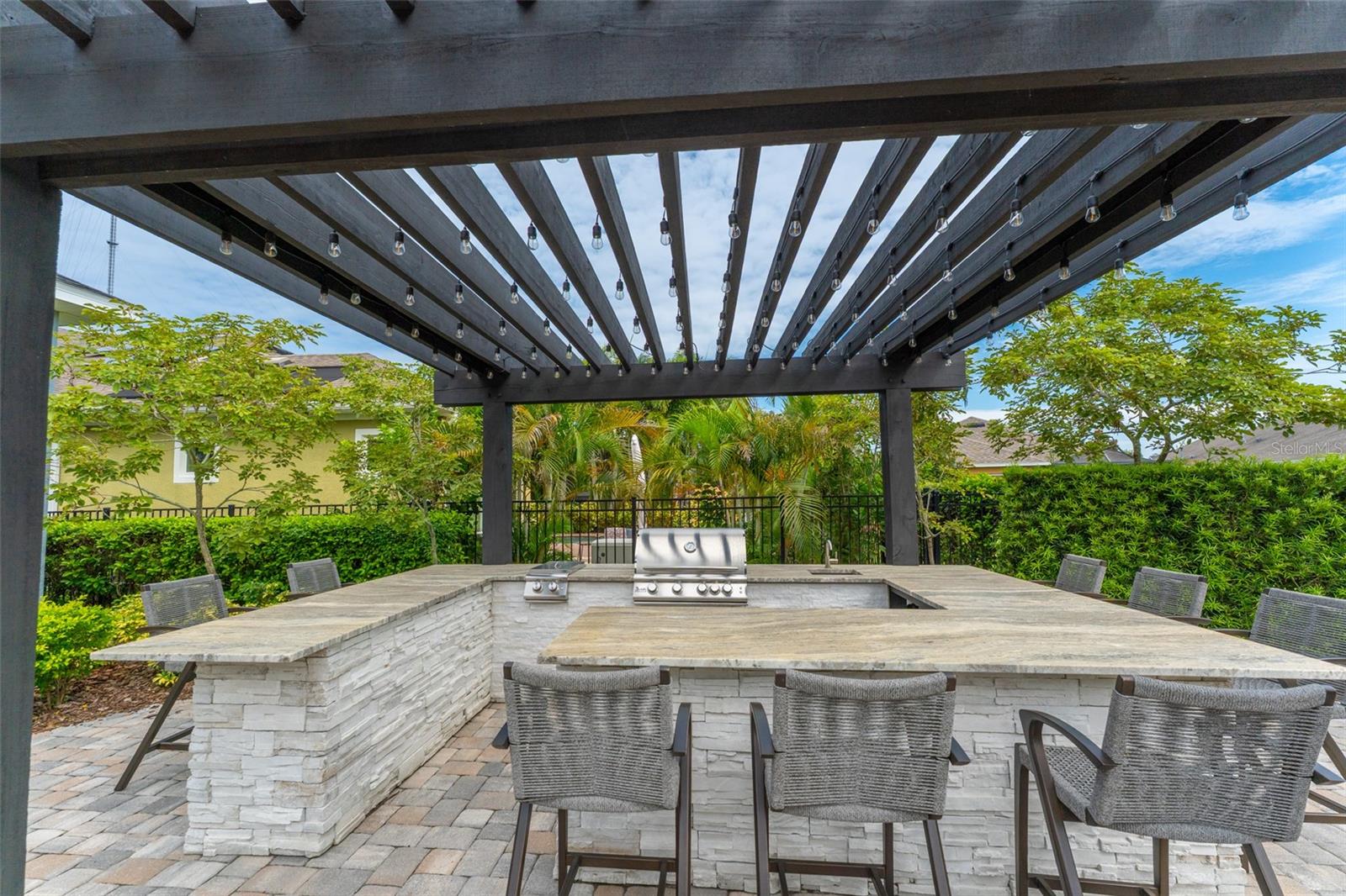 Outdoor Kitchen with Grill & Side Burner Under Pergola with Lighting
