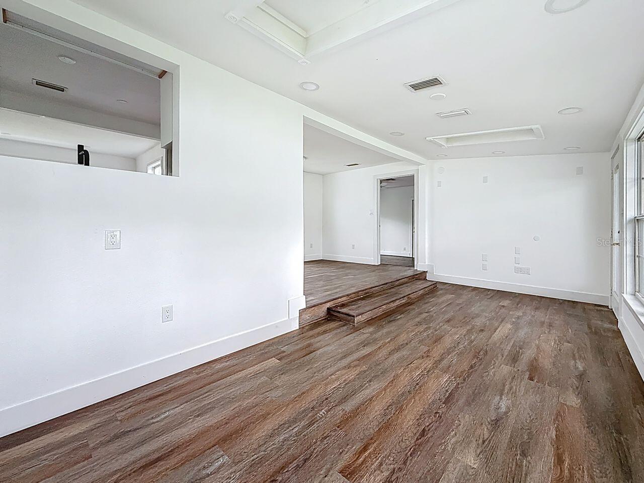 Living area with kitchen pass through towards dining area