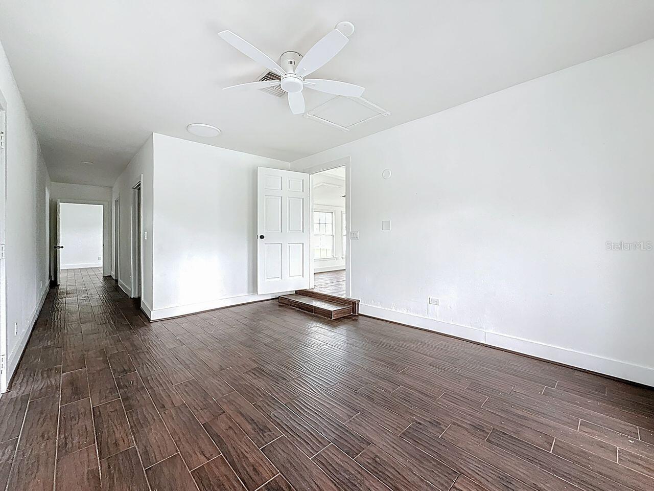 Primary bedroom towards dining/living