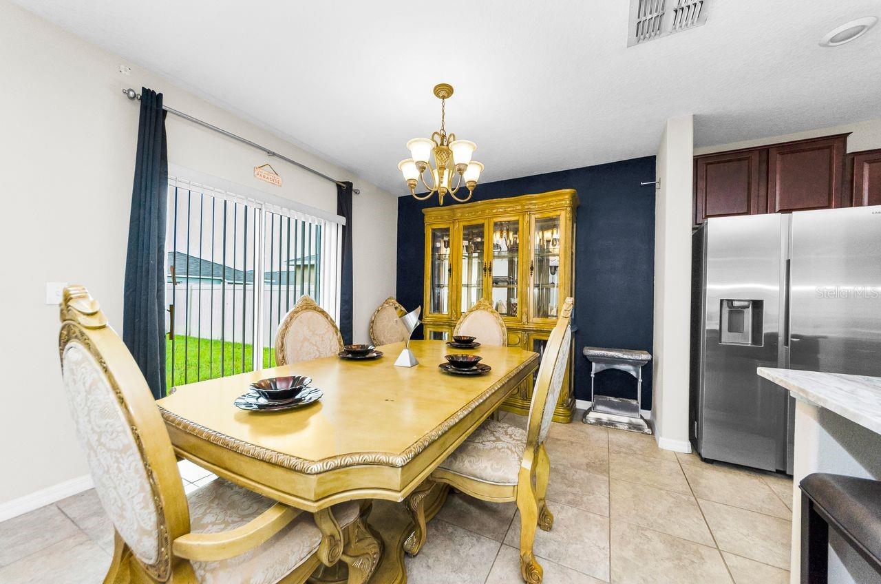 dining room opens to kitchen and living room