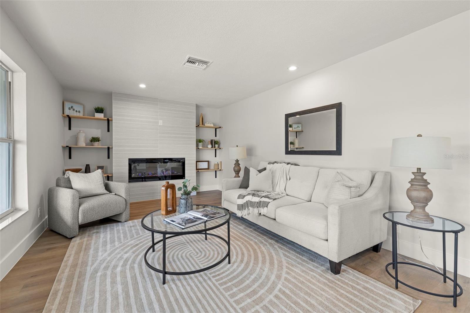 Floor to ceiling tile electric fireplace wall