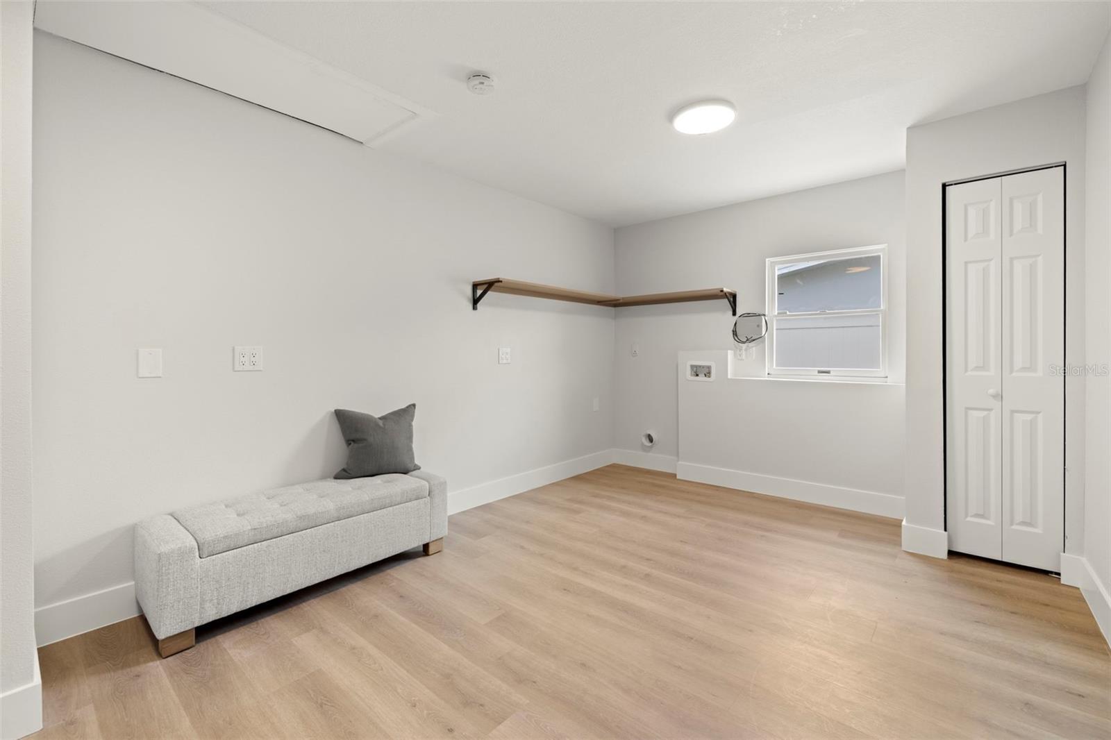 Laundry/mud room can be used as craft space, gym, office