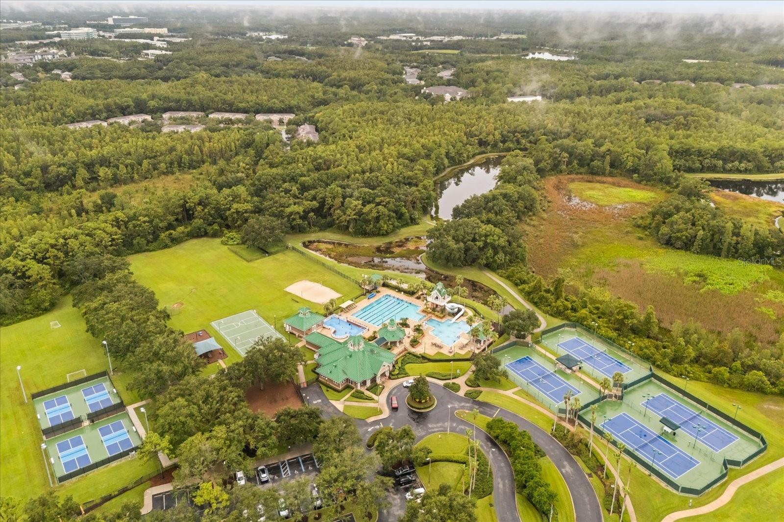 Pickleball tennis courts, multiple pools including lap-pool and water slide, basket ball and volley courts