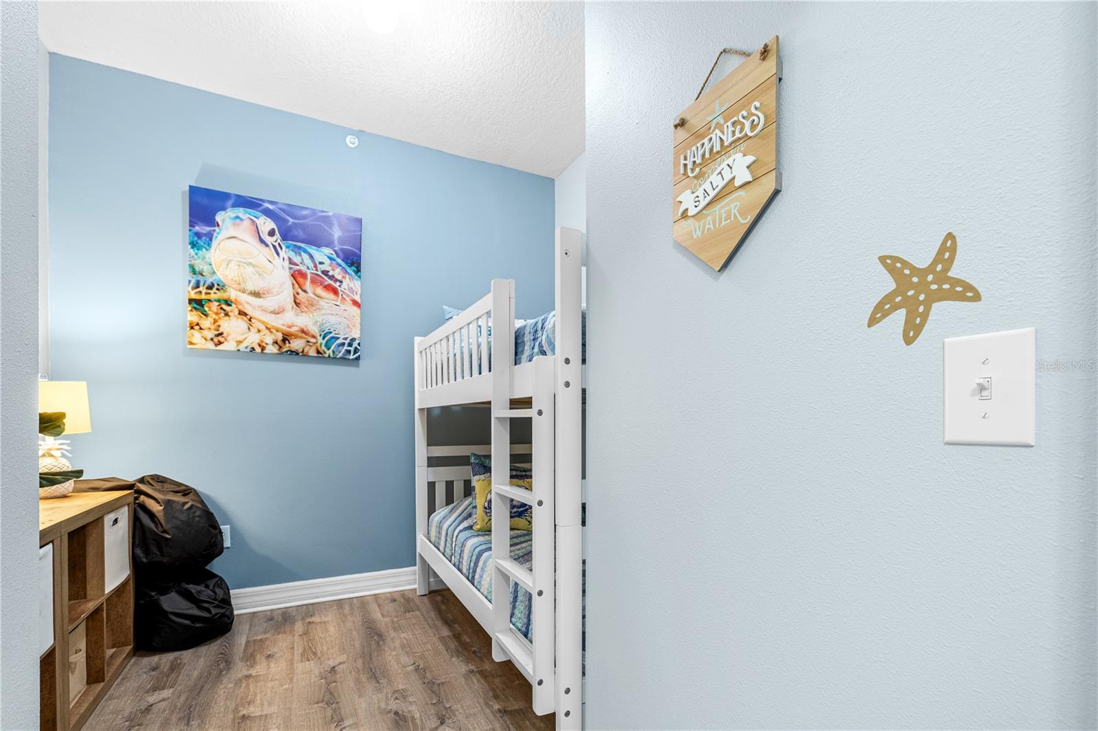 Second bedroom is a delight, fully outfitted with bunk beds, entertainment space and TV.