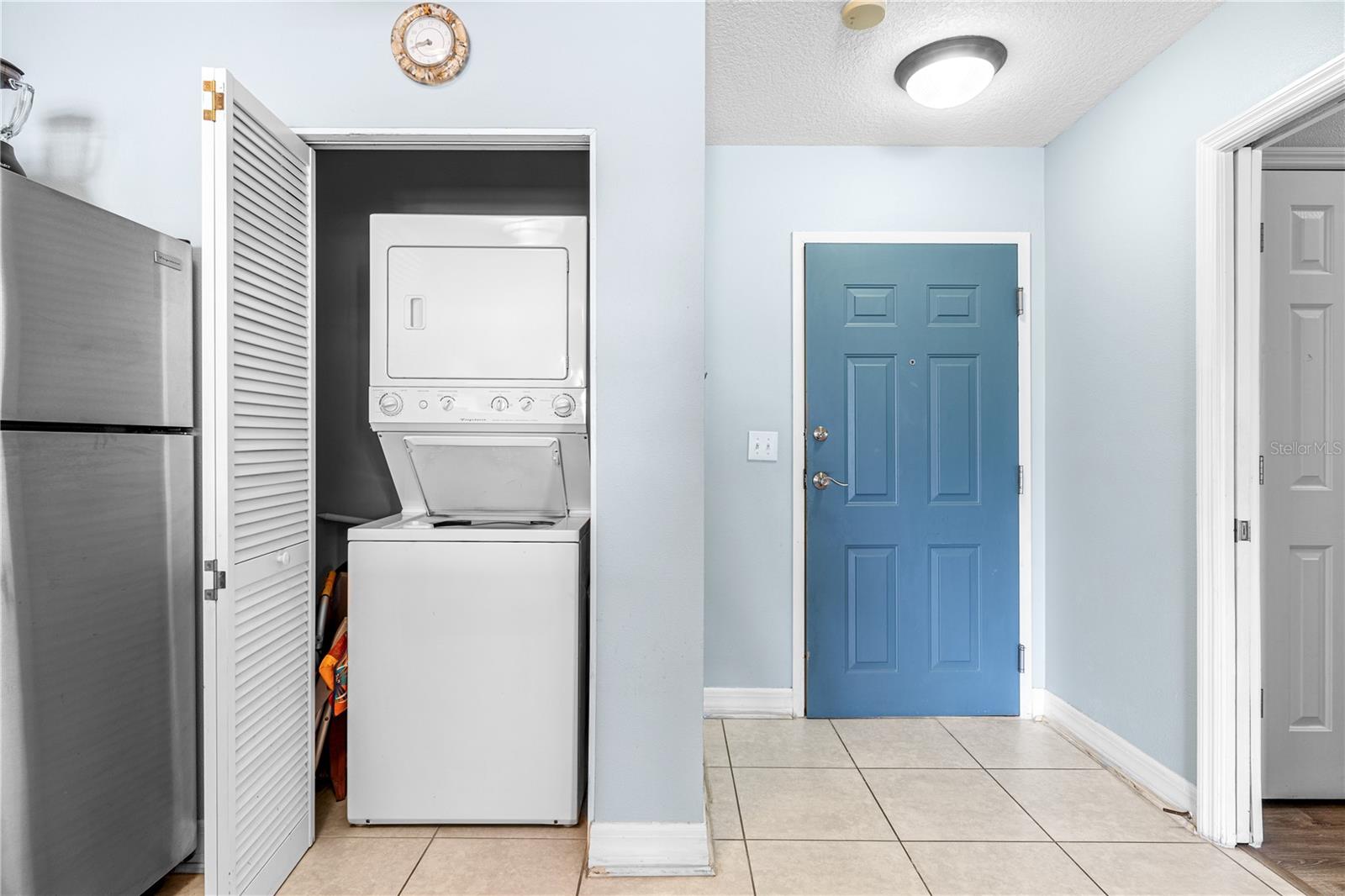 Washer and dryer conveniently located inside the unit