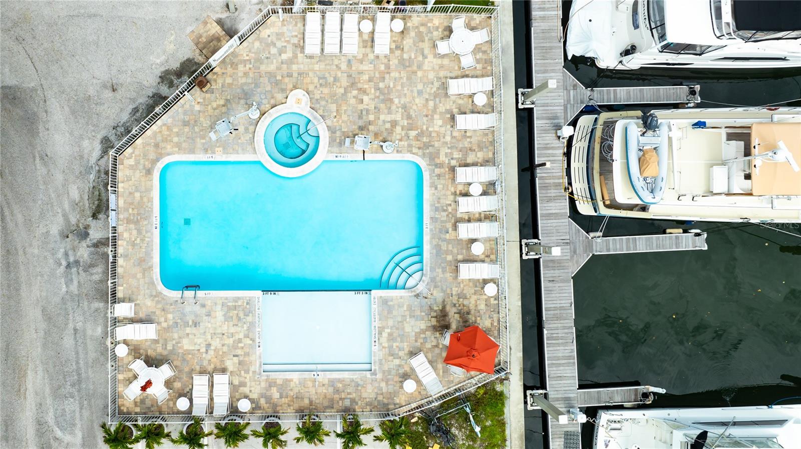 Recently refinished pool and pool deck with large sunshelf offers a great place for families to hang out, have fun or relax.