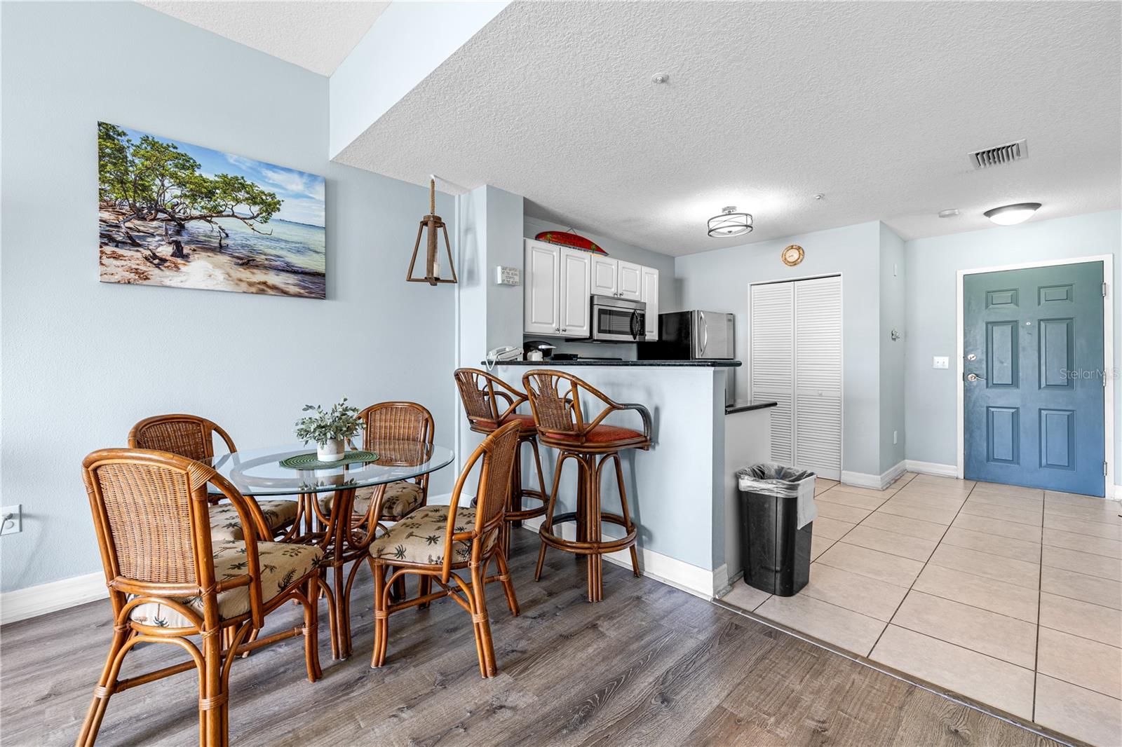 Open kitchen with dining room and additional seating at the bar