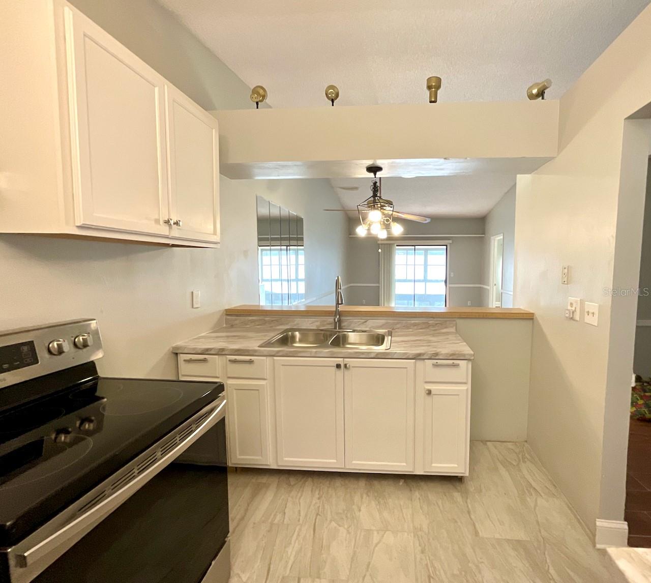 7-Kitchen sink area and view to combo dining living room