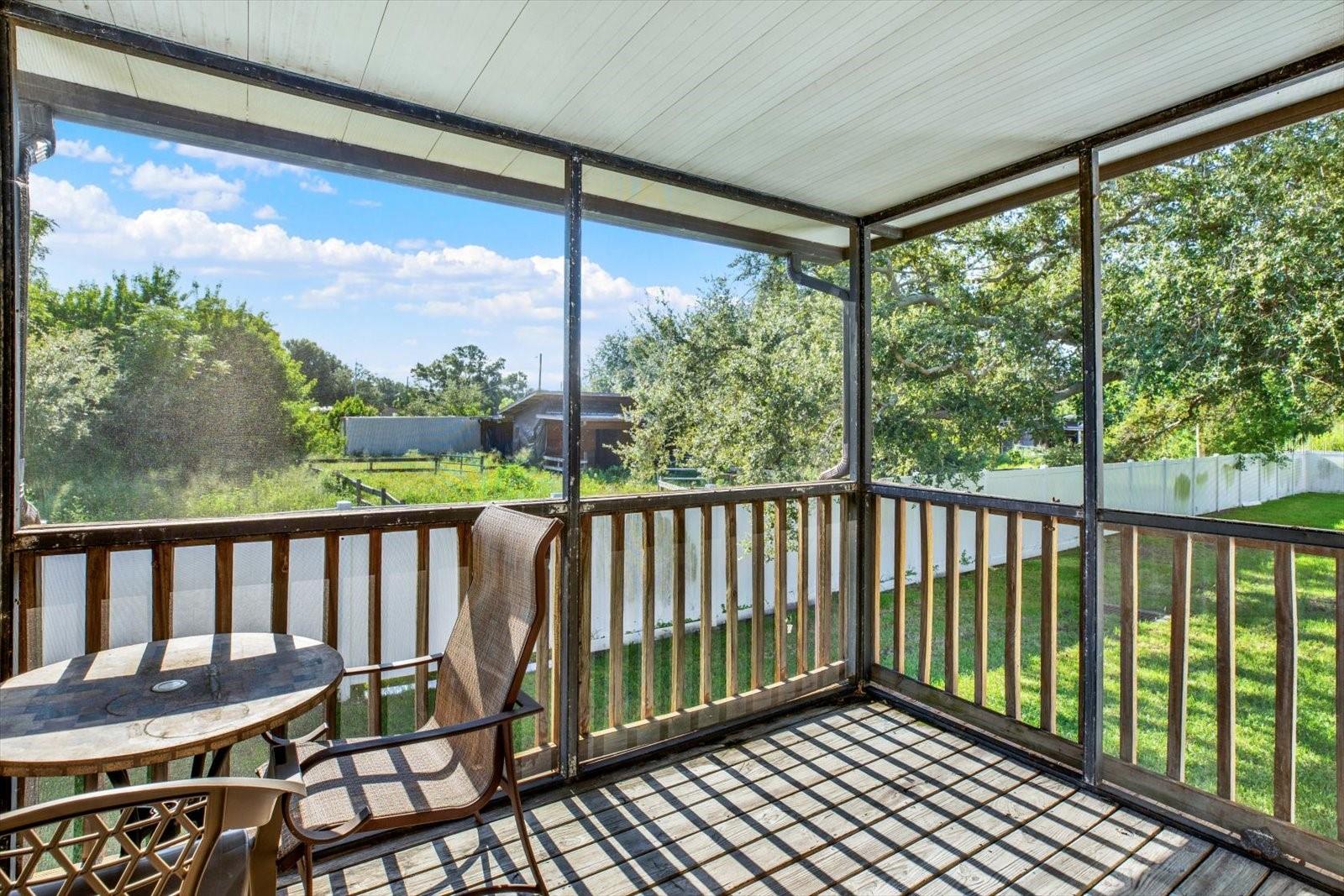 Cozy screened enclosed private Balcony overlooking a quiet horse farm