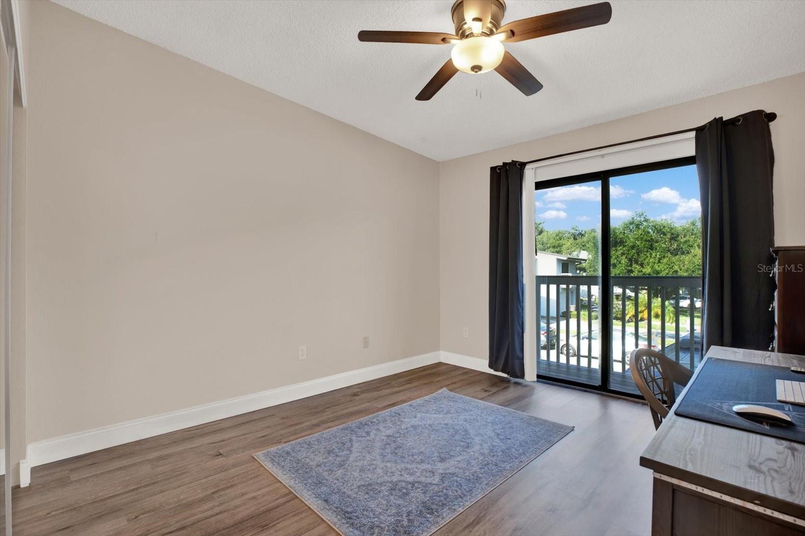secondary bedroom with private balcony