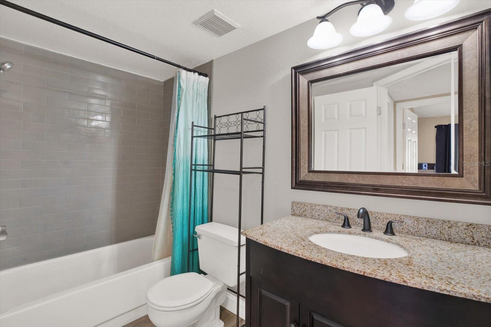 Updated Shared secondary bath, tub-shower combo