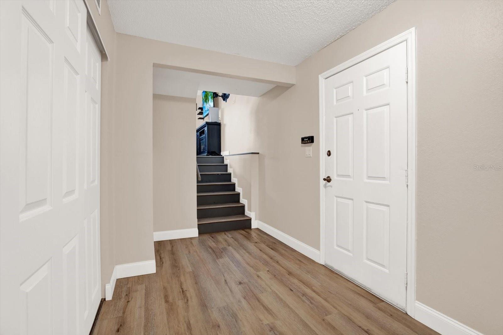 Foyer with large storage closet