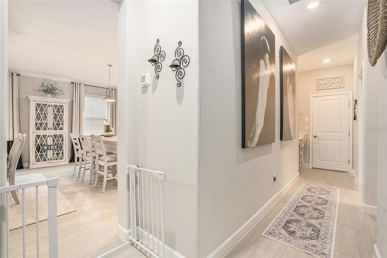 Hallway to the 2nd, bed, bath, laundry & garage