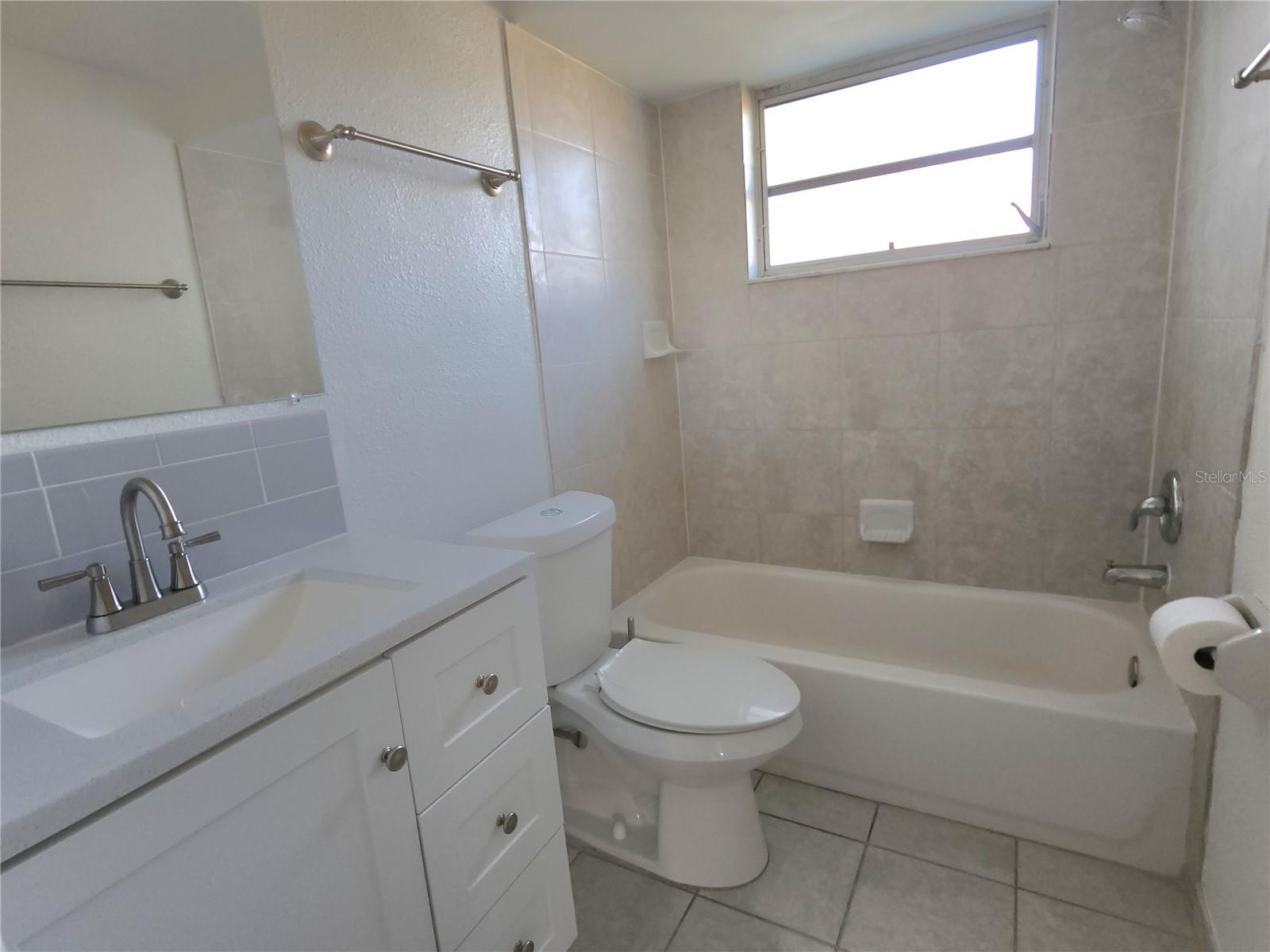 Open shot of Bathroom without the Shower Curtain
