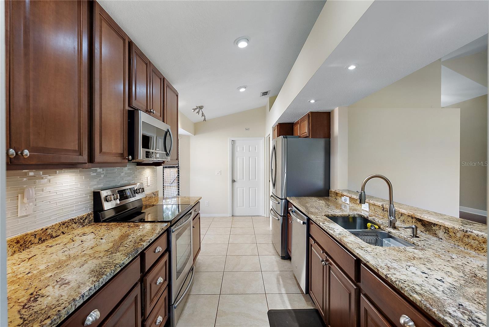 galley kitchen with granite countertop