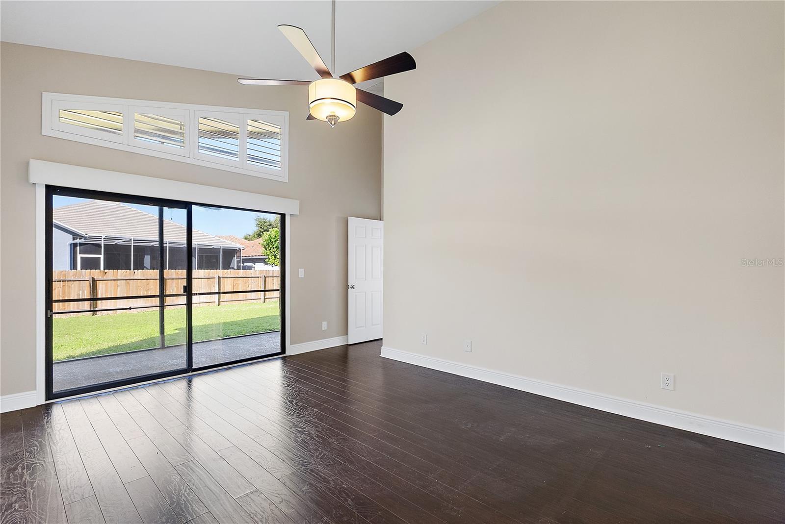 Primary with sliding glass doors to covered lanai
