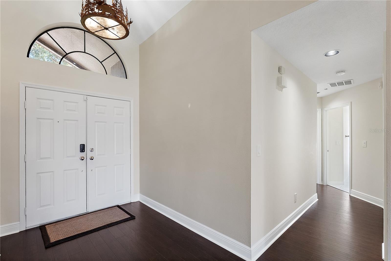 Double door entry with custom transom light above door