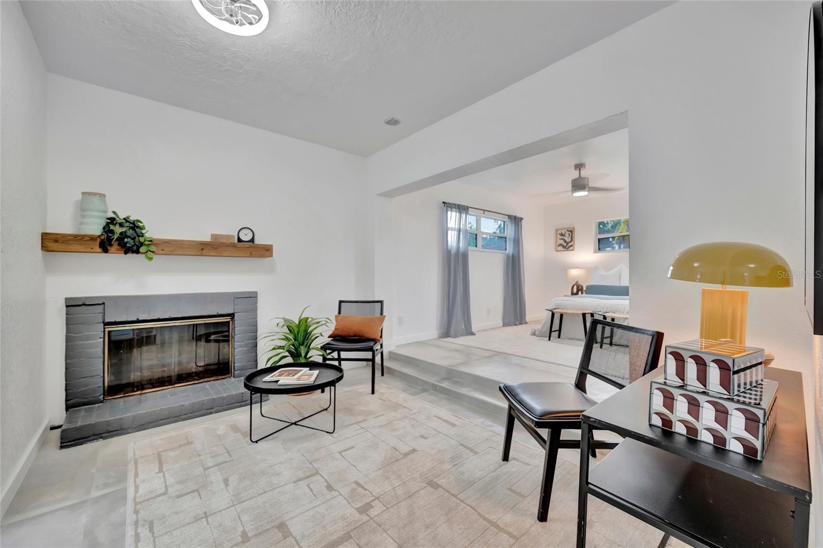 The reading area with the fireplace in the master bedroom