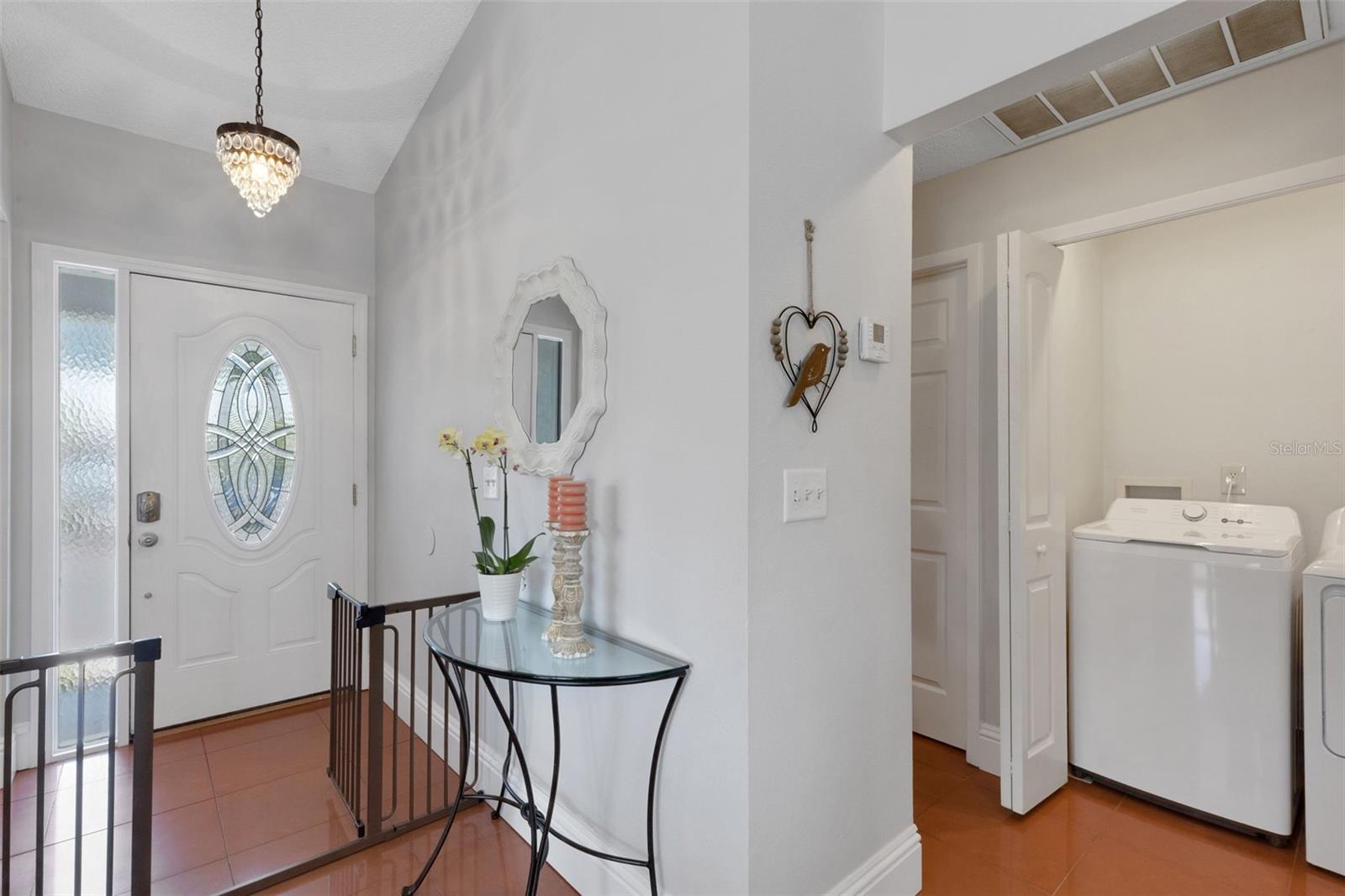 Hallway on right leads to guest bedroom and bath