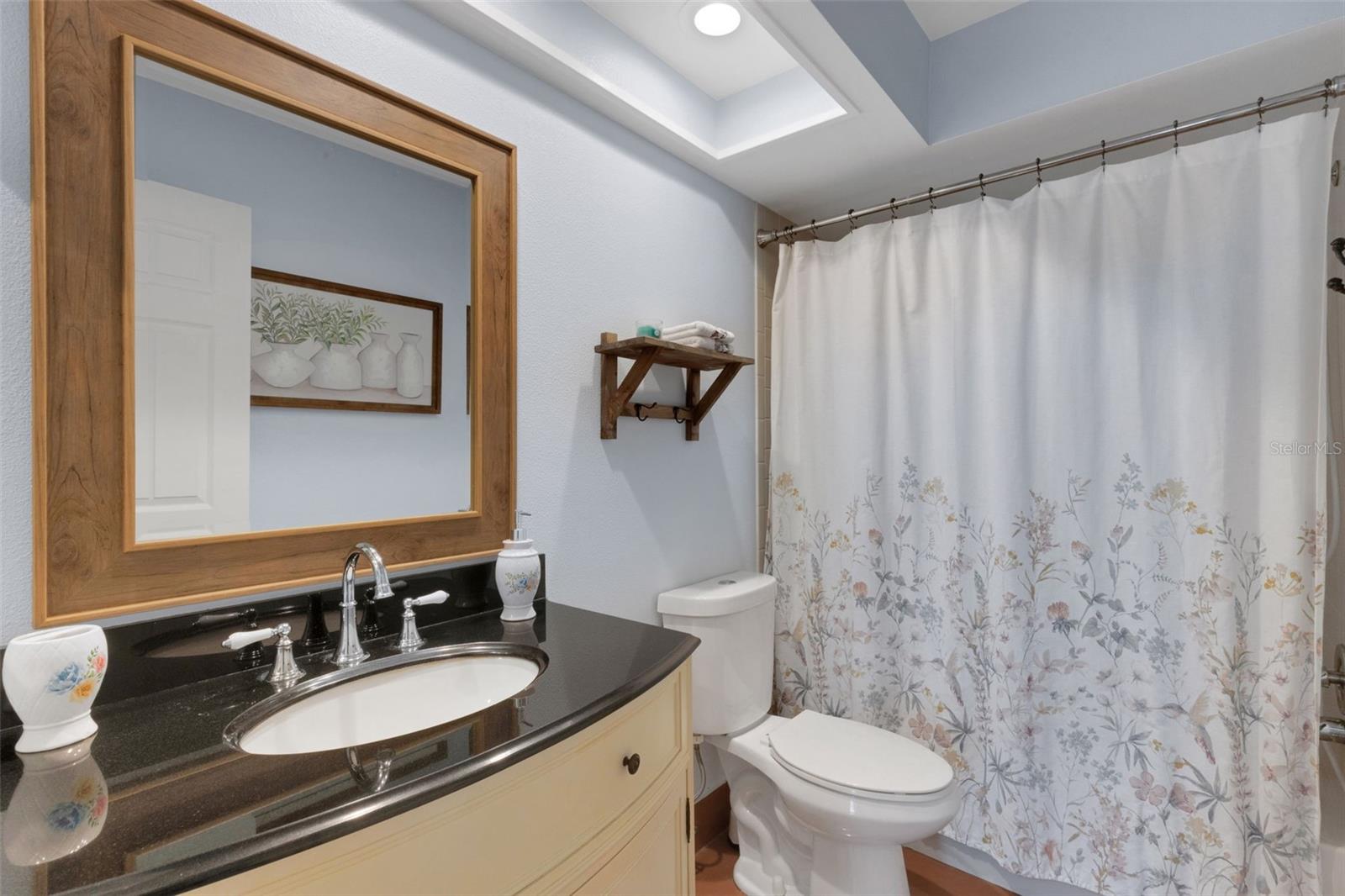 Guest bath with tub conveniently located next to guest bedroom