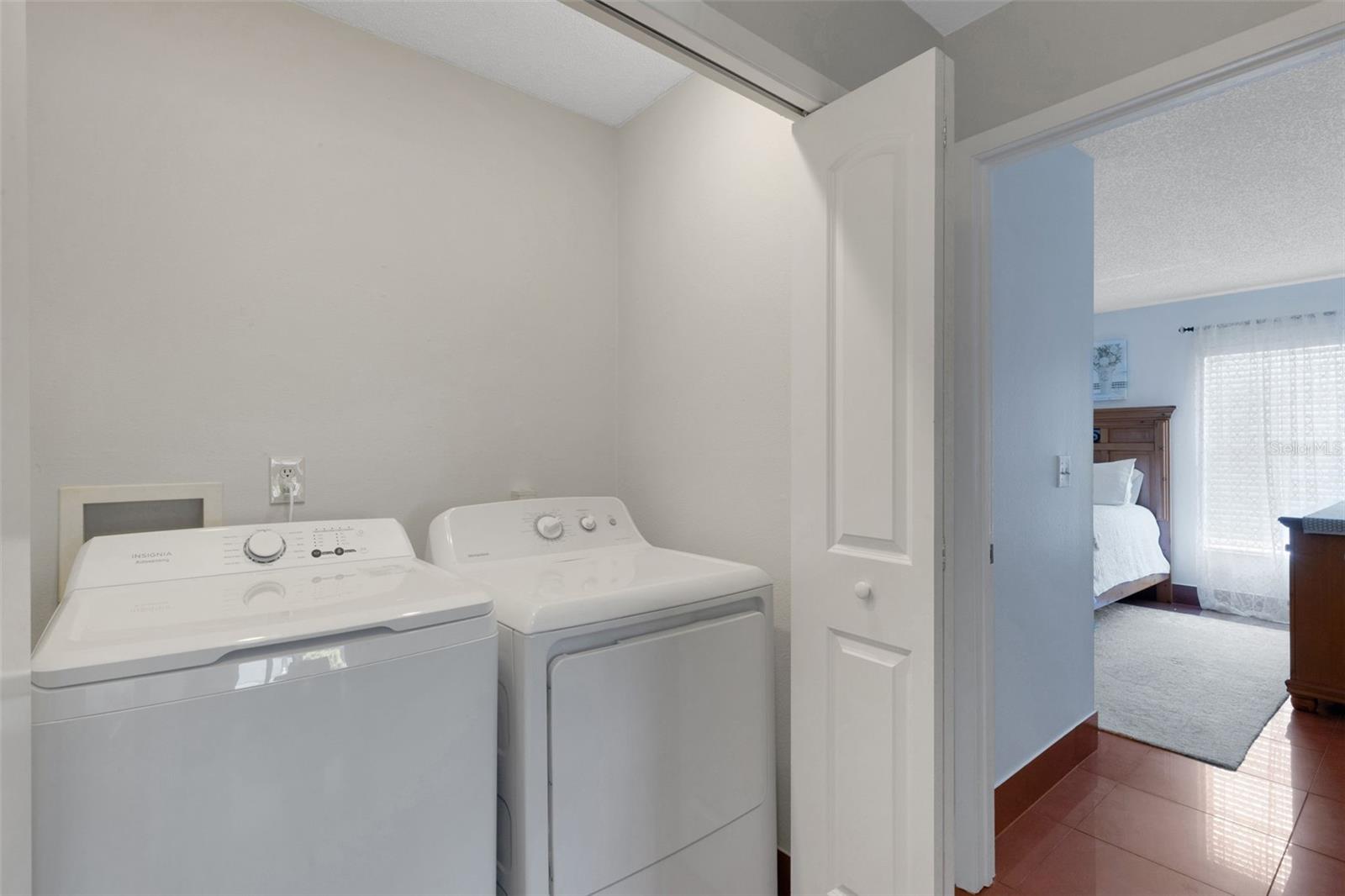 The Laundry closet, the primary bath and walk-in closet separate the bedrooms