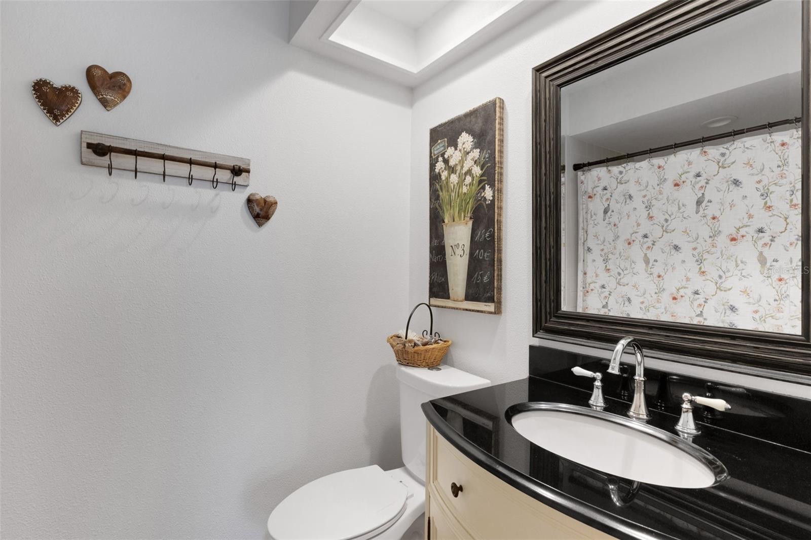 Primary bathroom has a step in shower