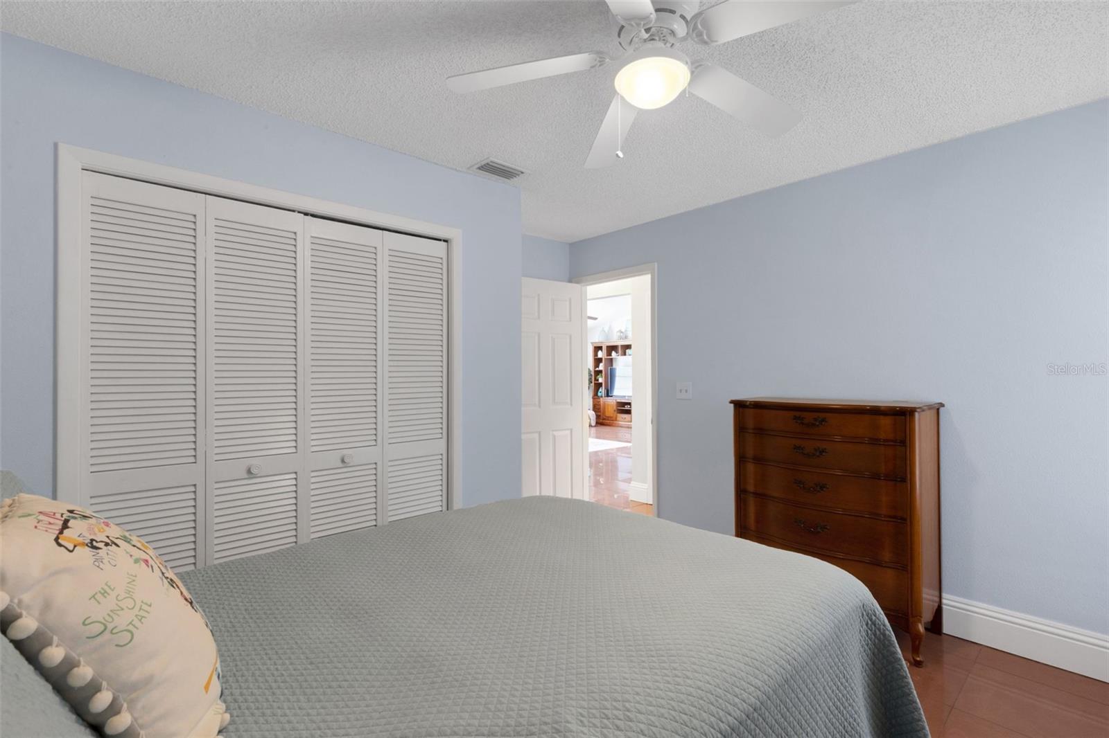 Another view of guest bedroom and hallway