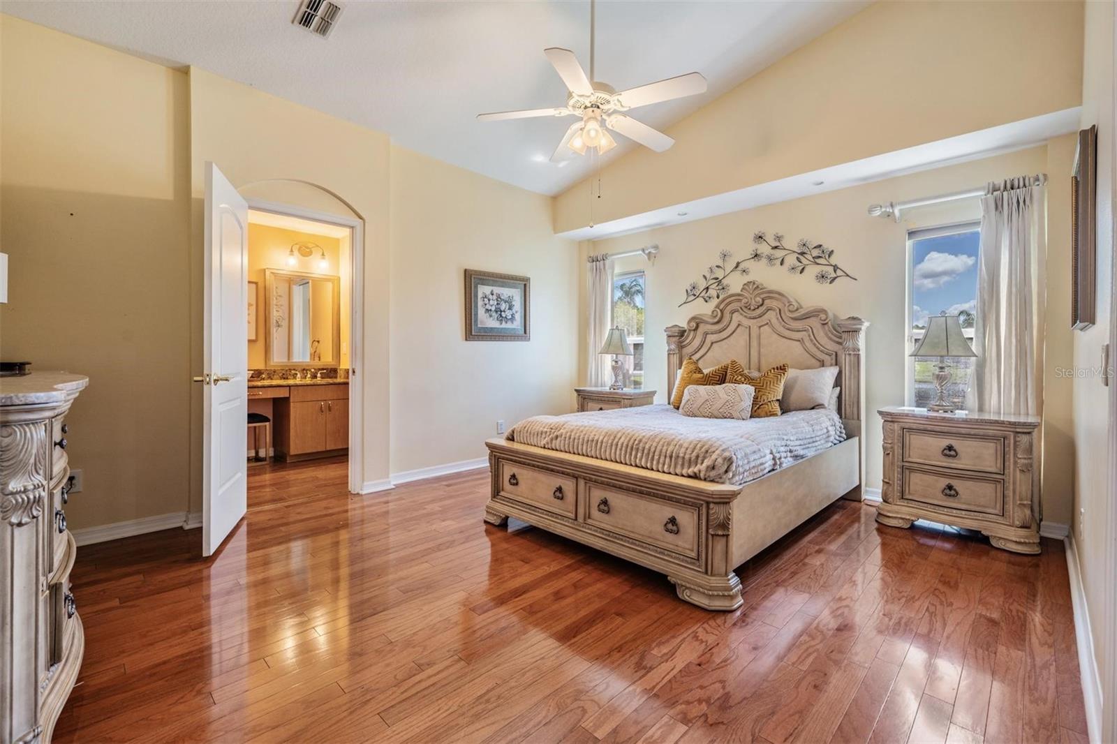 Primary bedroom with view of bathroom