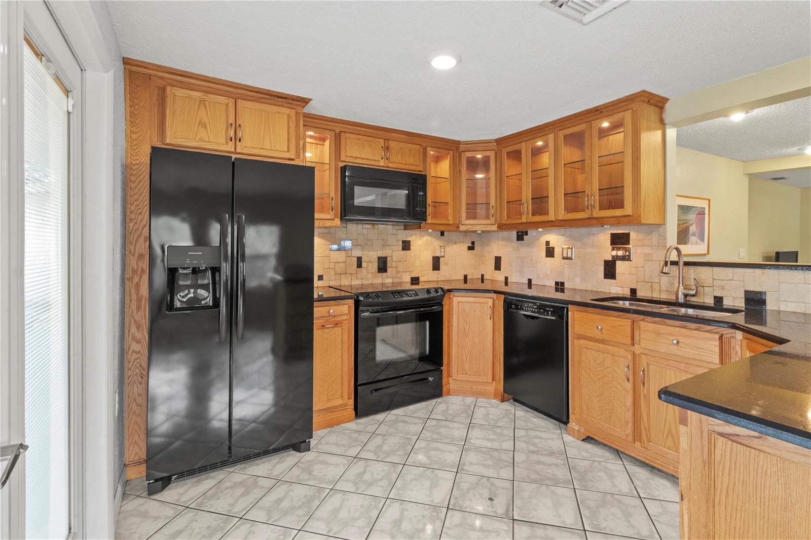 Wood cabinets with glass doors.