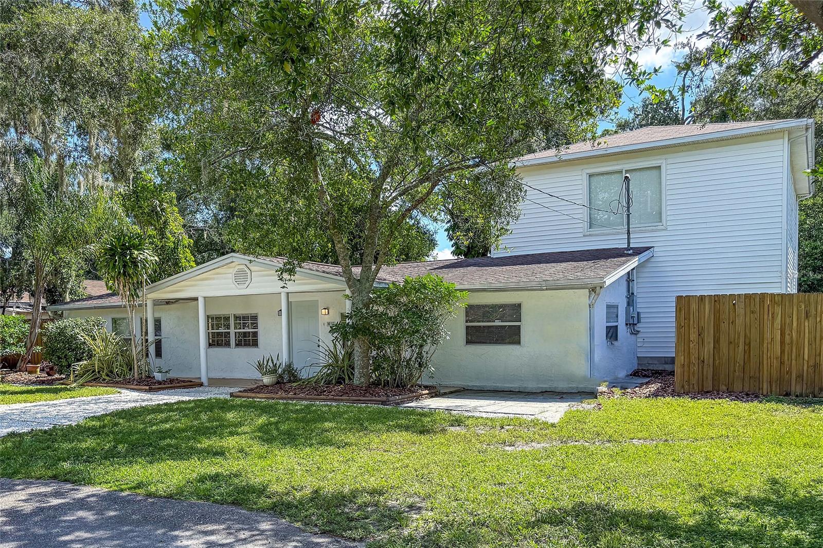 Right side of house with front yard.