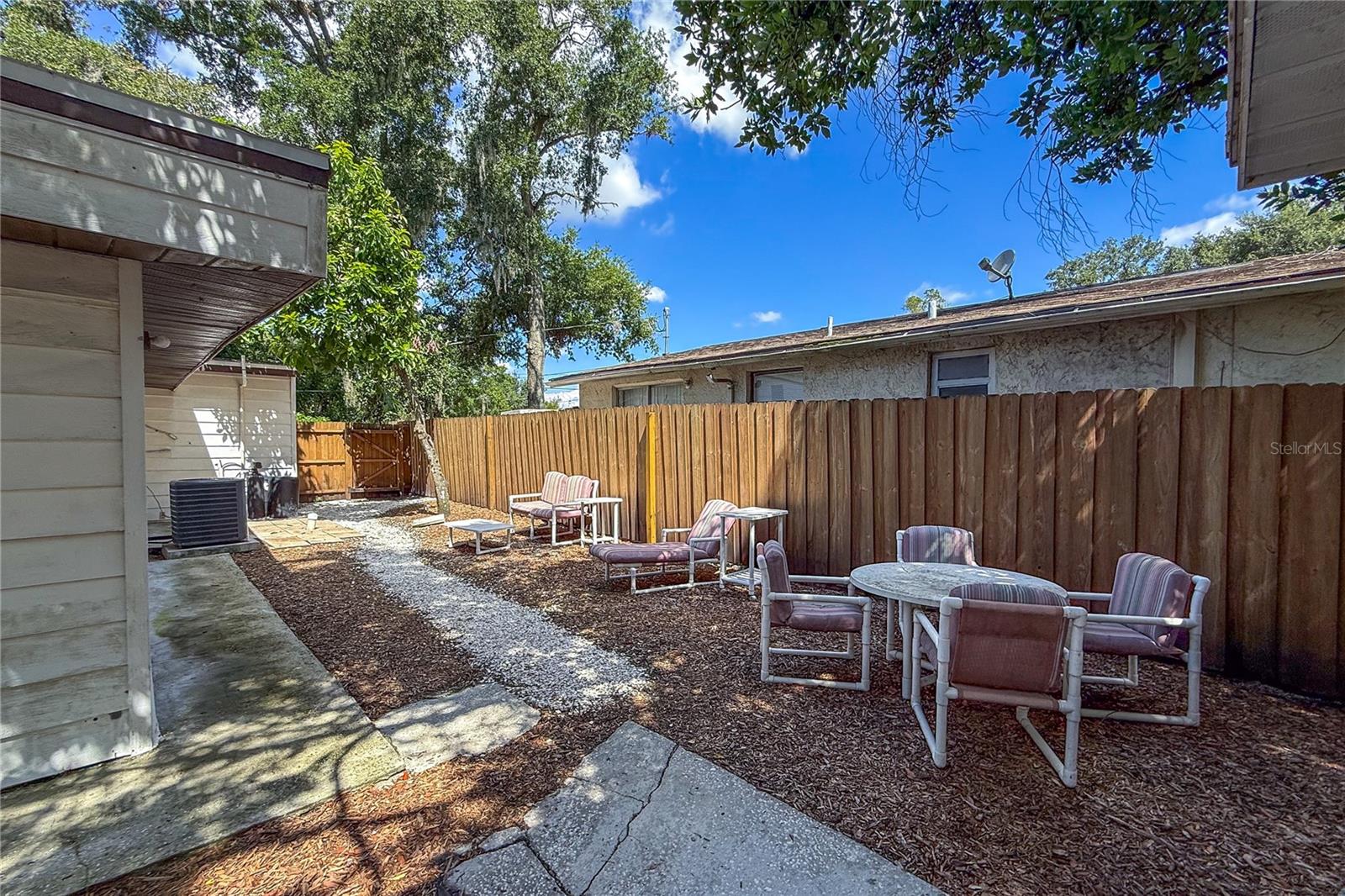 View of side yard from shed.