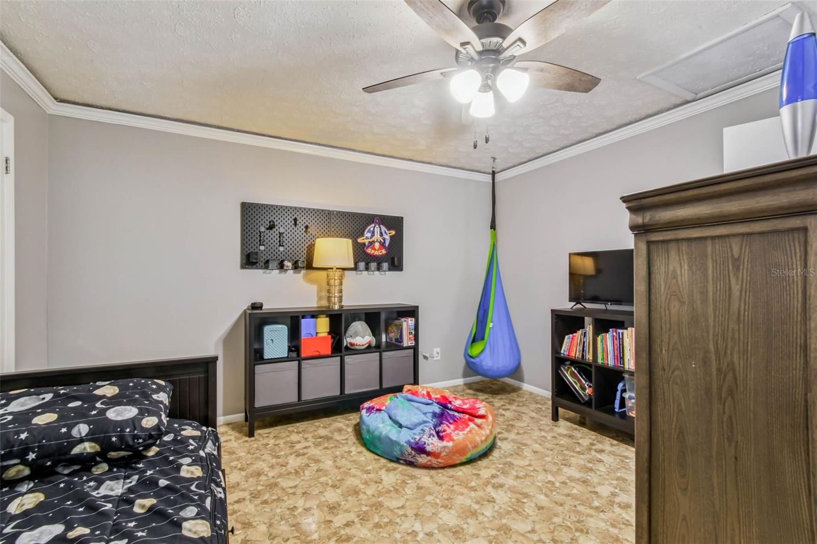 The secondary suite has its own private bathroom, a walk-in closet, a huge floor to ceiling window, and its own dedicated back door entrance that leads out to the covered, rear deck.
