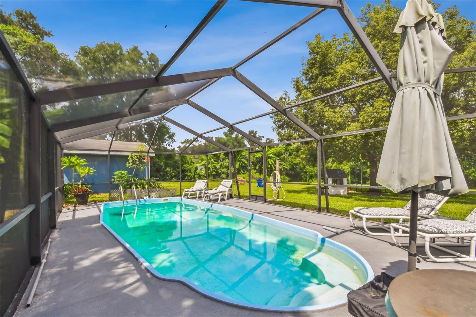 This screen enclosed pool is the perfect place to relax and unwind.