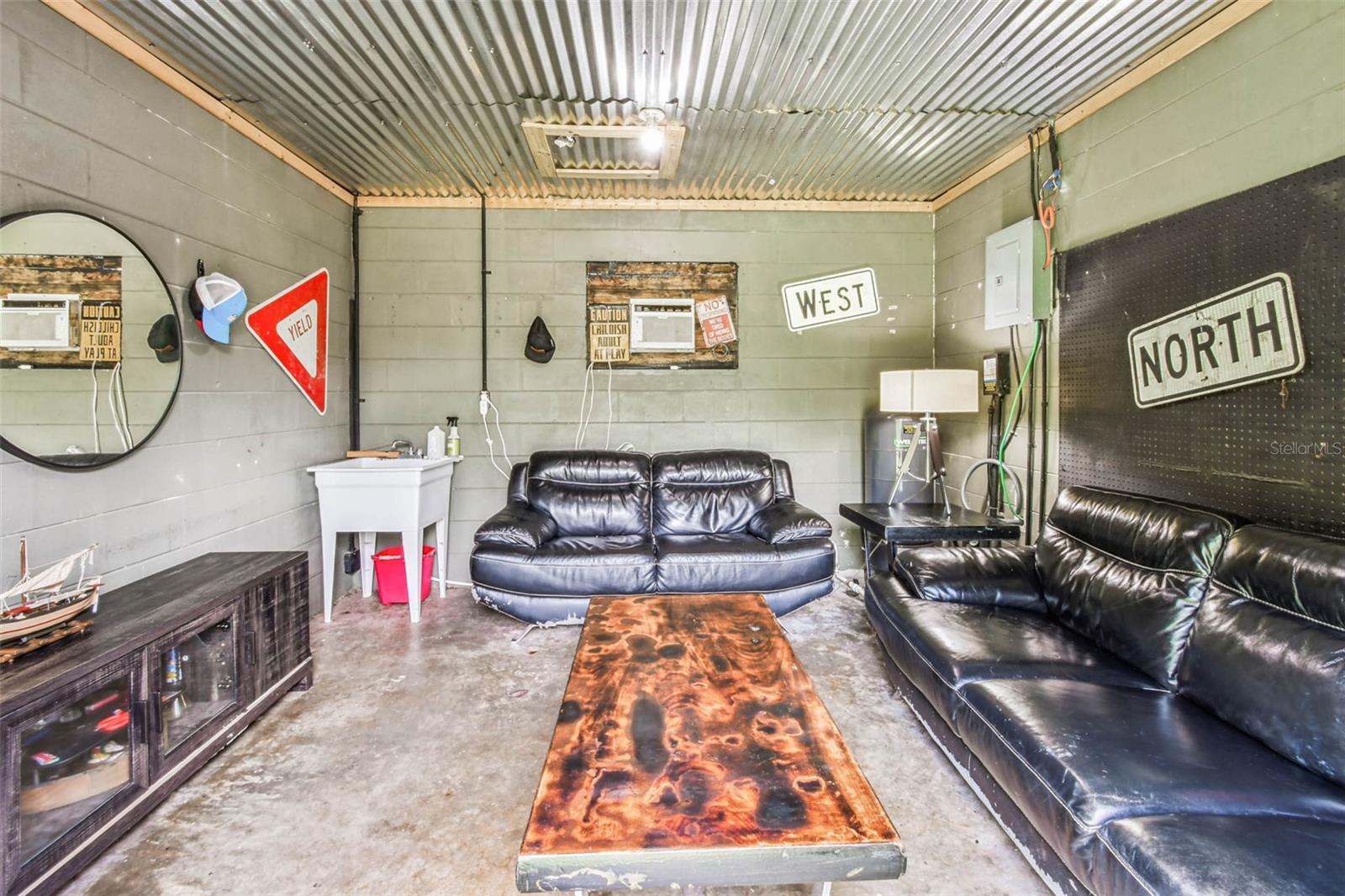 The current owner uses this as their man-cave, but the plumbing and electric gives this space some versatility as a workshop, she-shed...you name it!