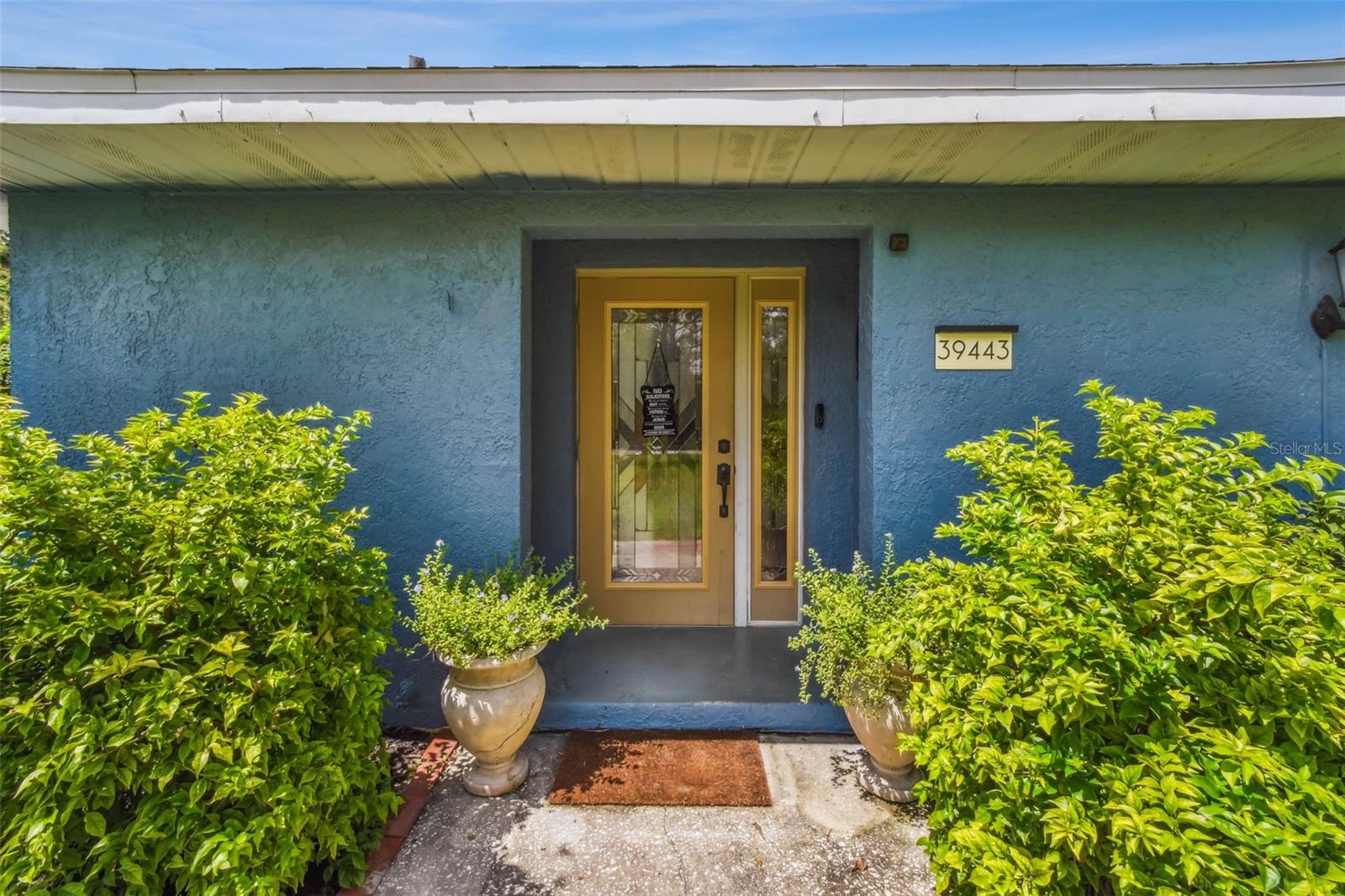 Check out this stylish entry door with a stained, leaded glass mosaic pattern...very sharp!
