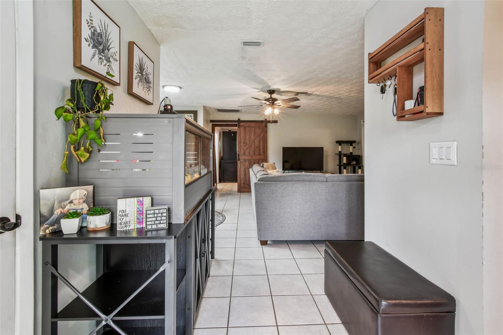 This extra wide foyer leads straight into the living room, or turn right to pass through the kitchen.