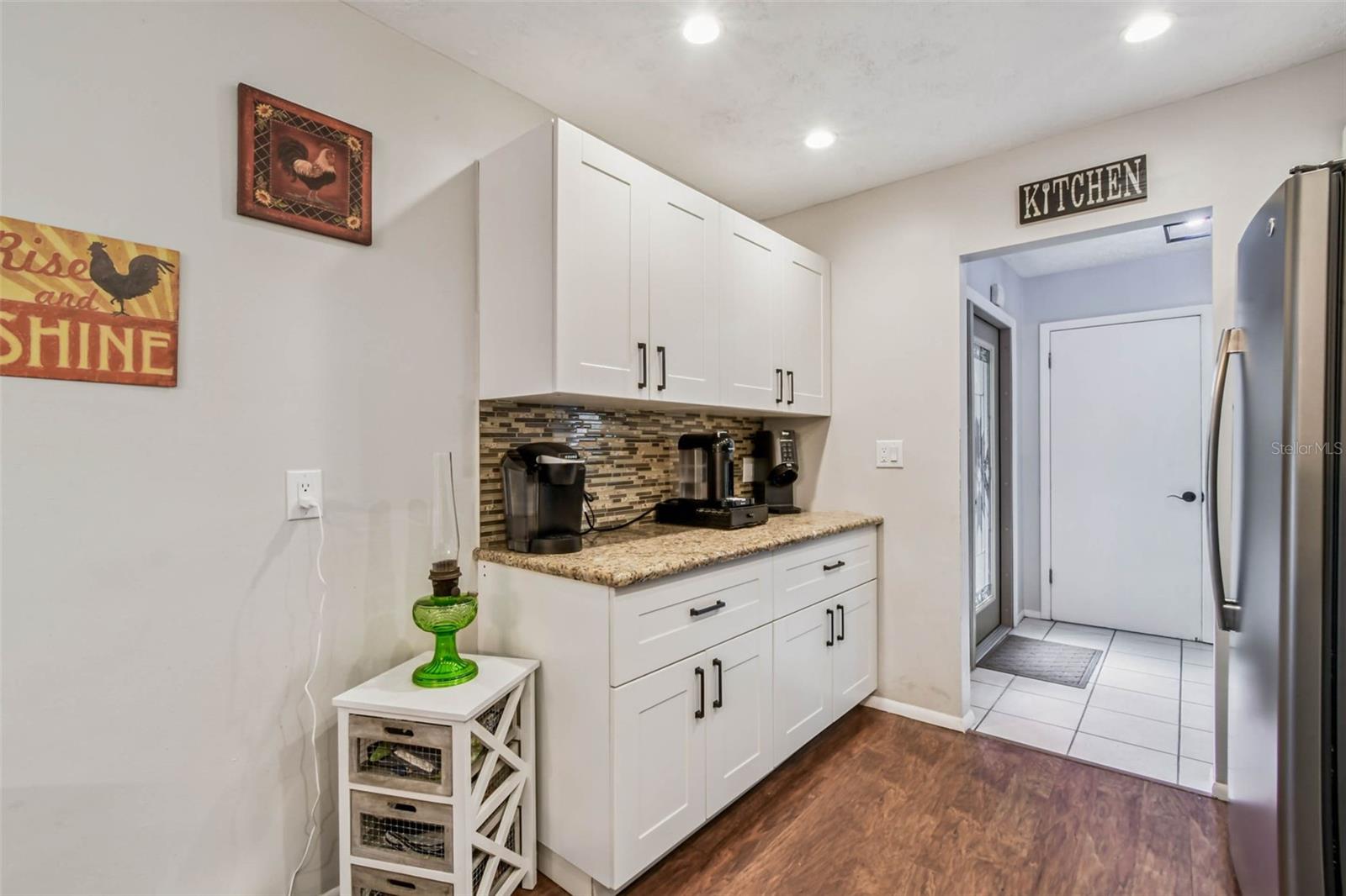 The pass-through kitchen is right off the foyer at the front entry.