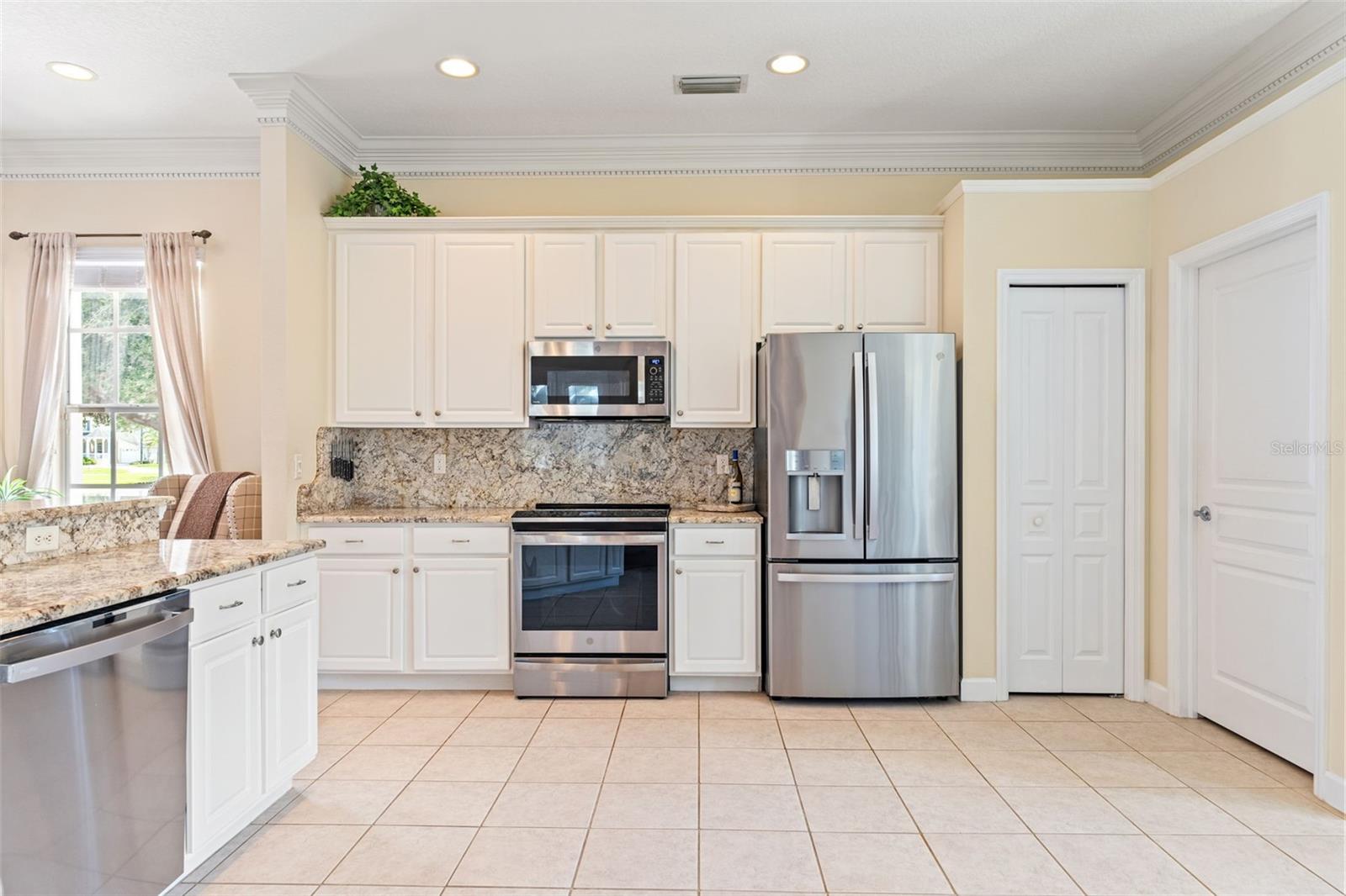 Light-filled kitchen opens to the dining area, perfect for entertaining and family gatherings.