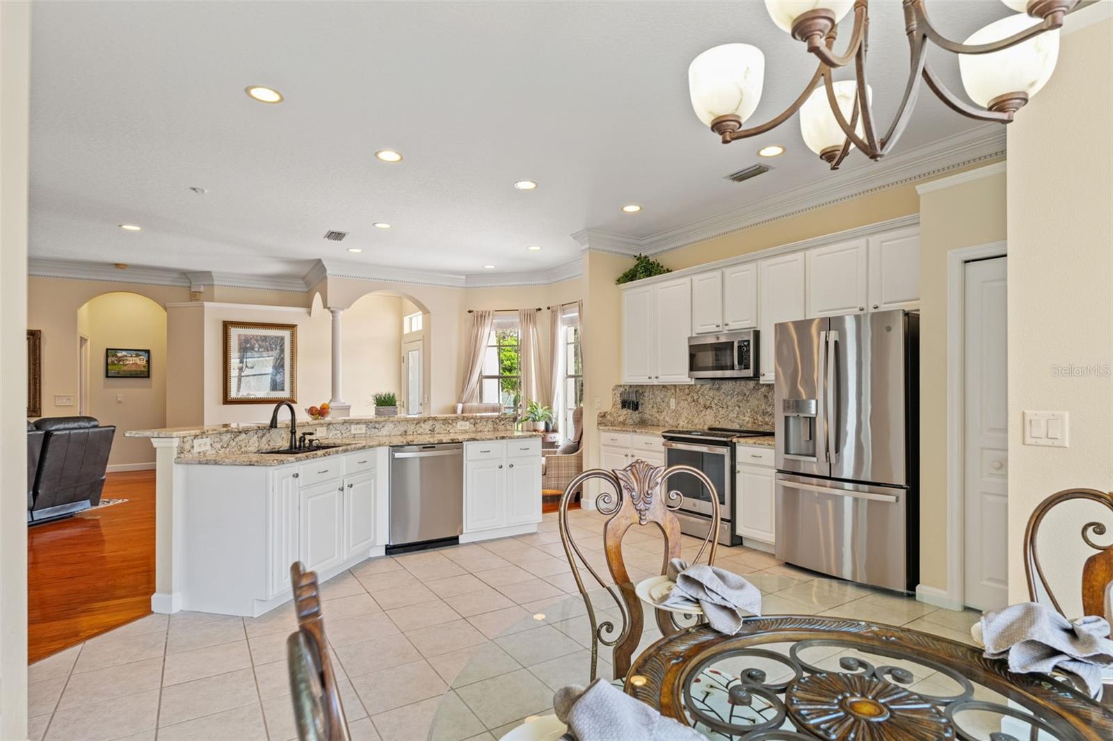 Open sightlines from the dining area to the kitchen and family room, creating easy flow for entertaining.