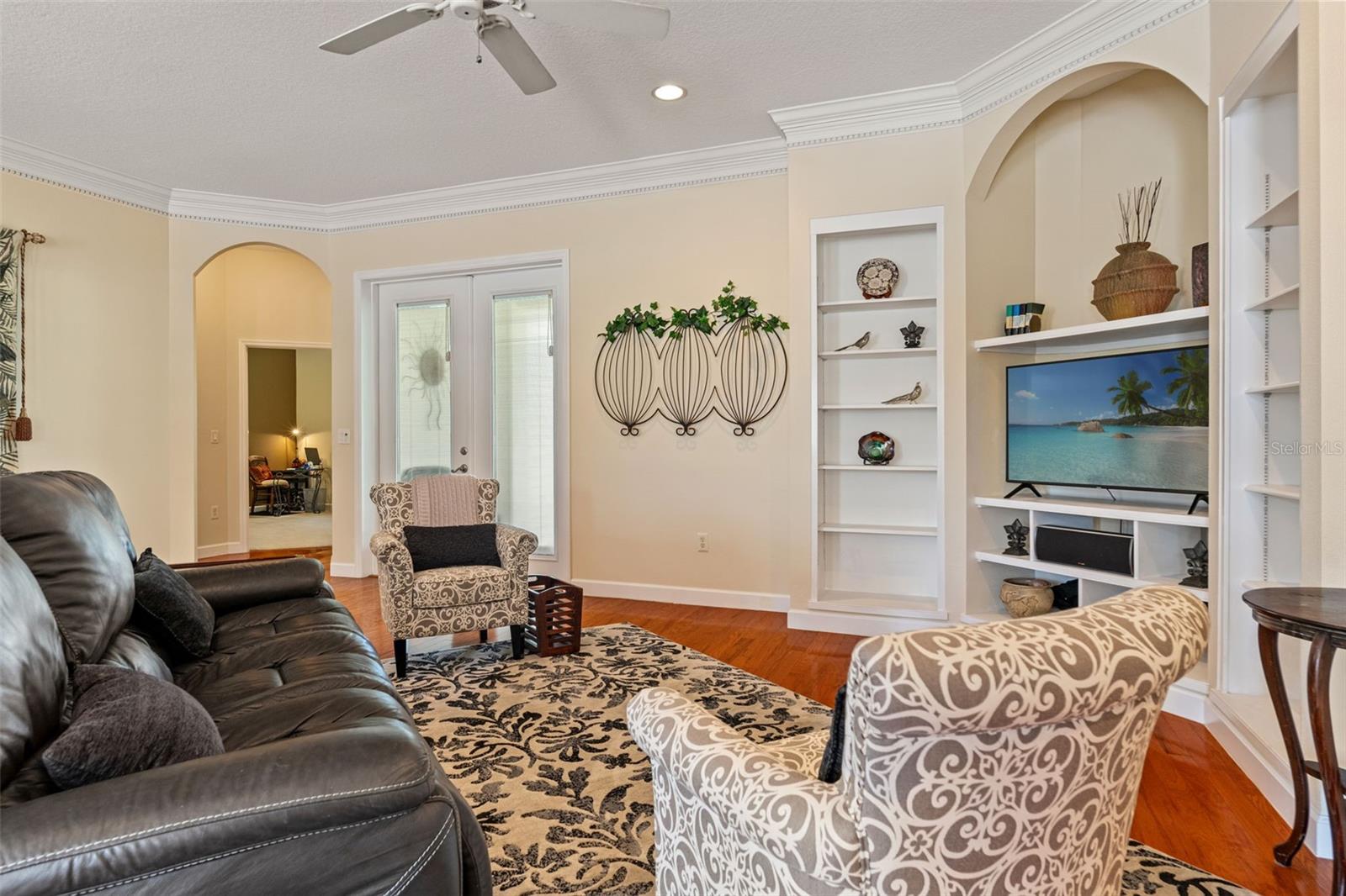 French doors and architectural arches highlight the home’s thoughtful design.