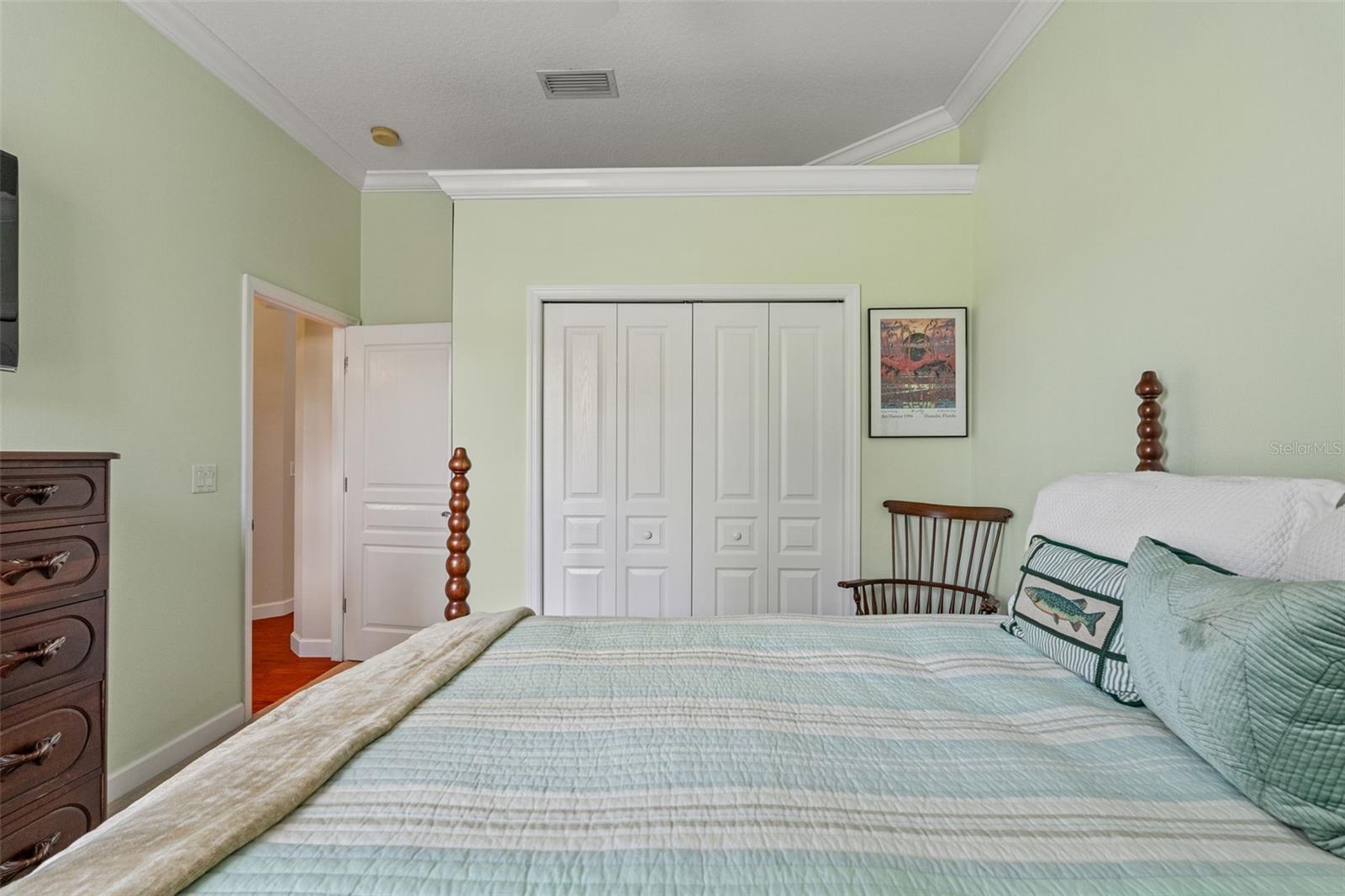Comfortable layout with double-door closet and ceiling fan.